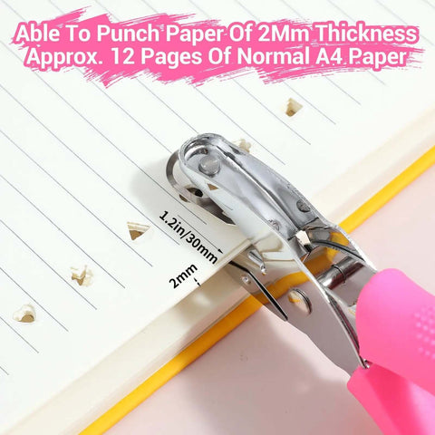 Close-up of Six Piece Craft Hole Punch Set for Scrapbooking, showing handheld punch with soft grip handles creating heart shapes in paper.