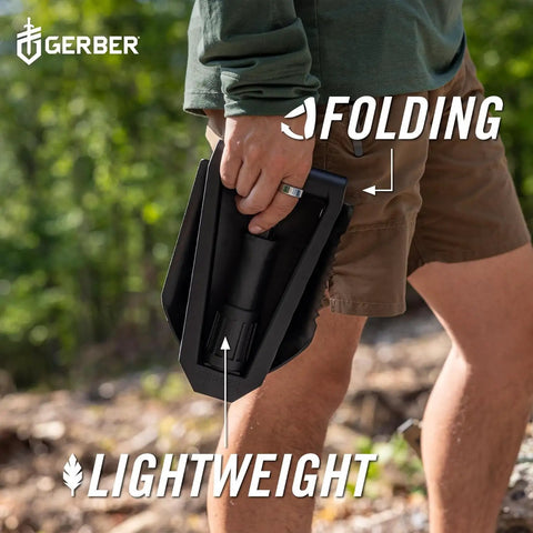 Person holding Military Style Tactical Folding Spade E Tool for Camping and Emergency Car Use, Heavy Duty All Purpose Shovel With Serrated Edge.