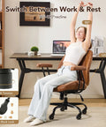 Ergonomic Home Office Desk Chair With Lumbar Support And Rubber Casters For All Day Comfort Smooth Glide Rolling Swivel Adjustable Height Executive Armrests Brown Leather in use.