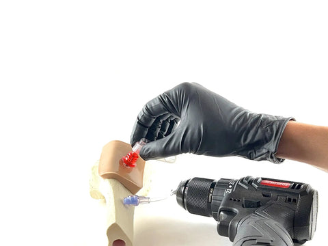 EZ-IO Compatible IO Drill Trainer Intraosseous Driver for Medical Instructors showing drill and training bone setup.