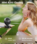 Portable Misting Clip On Fan With USB C Rechargeable Battery, misting on table outdoors next to person enjoying cool breeze.