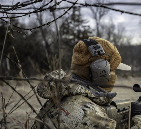 Hunter wearing Xcel 100 Digital Electronic Earmuff With Voice Clarity And Advanced Circuit For Hunters And Range Pros in the wild