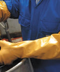 Worker uses Double Nitrile Coated Full Arm Chemical Resistant Safety Glove With Cotton Poly Liner, 20 Mil Thick, 26 Inch Length, X Large, 12 Pair Pack, Killer Grip For Oils, Grease, Abrasion, And Heavy Duty Work in industrial setting.