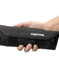 Person holding a black pouch labeled 'TEKTON', part of the Angle Head Open End Wrench Set With Pouch, 11-Piece, Inch Sizes 1/4 to 3/4.
