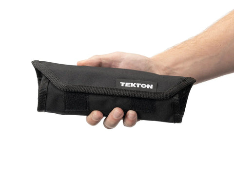Person holding a black pouch labeled 'TEKTON', part of the Angle Head Open End Wrench Set With Pouch, 11-Piece, Inch Sizes 1/4 to 3/4.