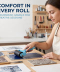 Straight Fire Blue Diamond Painting Roller Tool For Crystal Art Pressing Plastic Canvas Drill Applicator in use on art table.