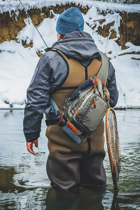 Fly Fishing Sling Pack For Quick Access Tackle Storage Shoulder Bag With Adjustable Padded Straps Go To Gear Organizer Army Green in snowy river scene