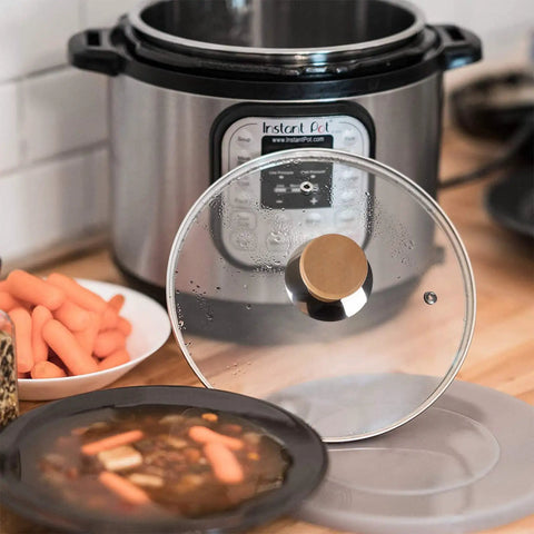 Tempered Glass Lid And Silicone Cover For Instant Pot 6 Quart Set Of 4 Accessories on a kitchen counter with food