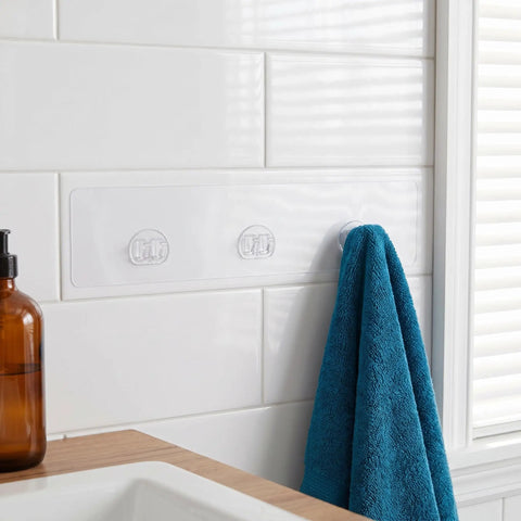 5Pc Heavy Duty Wall Mounted Storage Rack Featuring Hardcore Adhesive Hooks For Bathroom And Shower Caddy No Sweat Rent Friendly Plastic Shelf Rack Quick Grip Design holding a blue towel.