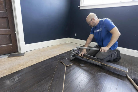 Installer using Ultra-Lite 9 Inch Flooring Cutter For Vinyl Plank, LVP, Laminate, Engineered Hardwood And Siding, Cuts 9 Inches Wide