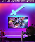 Dope Remote Controlled RGB Hexagon LED Lights For Gaming Setup With Touch Sensitive Panels above TV in lit room