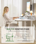 Woman using Electric Standing Desk With Drawers 48 By 24 Inches Height Adjustable Sit Stand Desk With Monitor And Laptop Stands