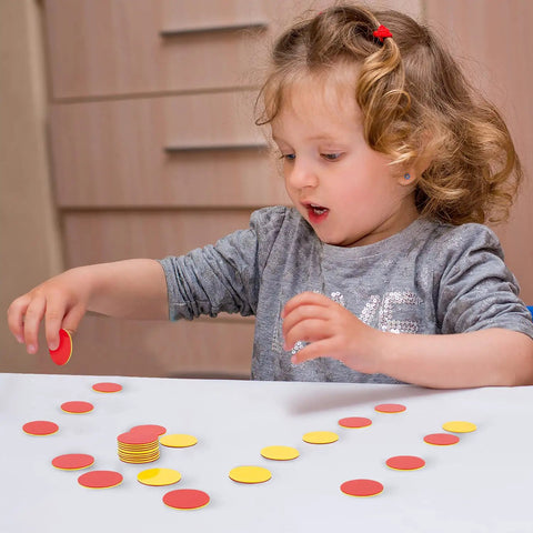Child uses Round Math Counters Set, Durable Plastic Counting Chips In Yellow And Red, 200 Pieces for hands-on learning.