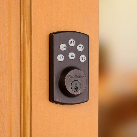 Keyless Entry Deadbolt Electronic Door Lock With 6 Button Keypad Illuminated Night Entry No Hassle Auto Locking And Keyed Pick Resistant SmartKey Rekey Security Technology Venetian Bronze Finish on a wooden door