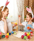 Mother and daughter painting eggs with Clear Plastic Egg Cartons Bulk 200 Pack 3x4 Grid Stackable Trays on table