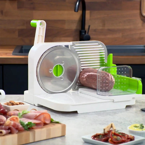 Top Notch Manual Rotary Deli Slicer With A Six Point Five Inch Serrated Blade And Dead Simple Thickness Tweaks Plus Bonus Two In One Peeler For Hassle Free Carving Of Meats Cheeses Bread And Big Loaves