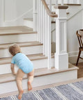 Baby crawling on stairs with Non Slip Stair Treads Tape 15 Pack 4 By 24 Inches Ultra Strong Adhesive for Smooth Surfaces