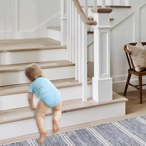 Baby crawling on stairs with Non Slip Stair Treads Tape 15 Pack 4 By 24 Inches Ultra Strong Adhesive for Smooth Surfaces