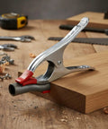Kick Ass A-Clamp Locking Pliers Made From Tough Alloy Steel securing a pipe on wood during assembly.