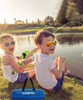 Children fishing by a lake with All In One Kid Friendly Fishing Rod And Reel Set With Tackle Box Lures And Portable Bag