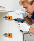Man using a Magnetic Hinge Jig With Precise Adjustable Clamps For Cabinet Doors Panels Drawers And Deck Installations No Drill Quick Mounting Tool