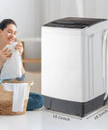Slick 17.6 Lbs Compact Portable Washer With Clear Led Screen And Ten Program Settings For Swift Laundry Loads In Tight Dorms Or Apartments With Heavy Duty Drain Pump And Smooth Stainless Drum next to a woman preparing clothes.