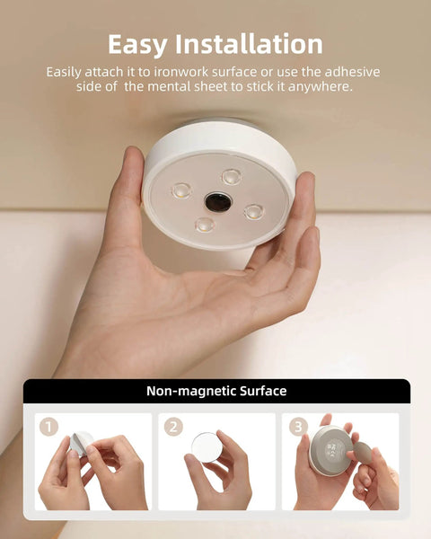 Person holding Under Cabinet Lights With Motion Sensor And 2 Color Temps Puck LEDs 1200mAh for easy installation