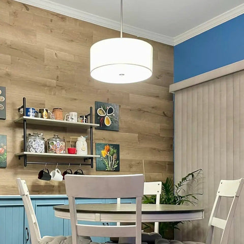 Three Light Drum Pendant Chandelier With White Fabric Shade Brushed Nickel Finish Tempered Glass Diffuser over dining table
