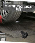 Mechanic using Beefed-Up Spare Tire Hold Down Bolt Kit for cars with heavy duty clamp hardware on tire