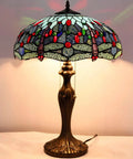 Sea Blue Dragonfly Style Stained Glass Lamp Shade Replacement 16x8 Inch with cap, warm glow on brass table lamp, artistic design.