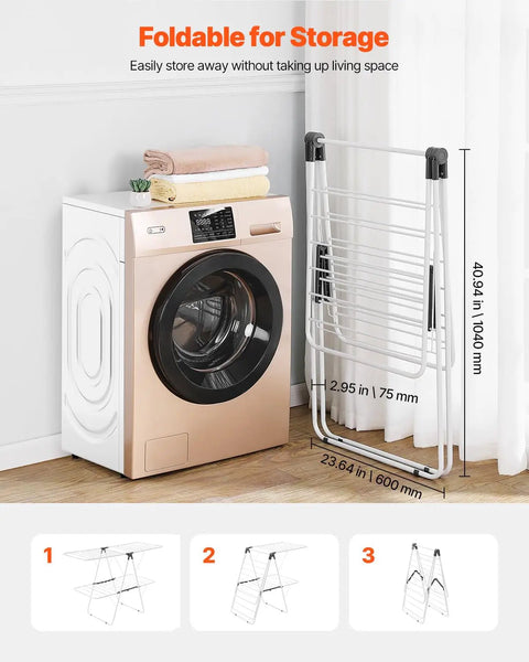Heavy Duty Two Tier Clothes Drying Rack With 31 Sturdy Rods And Sock Clips Foldable Metal Laundry Stand next to a washing machine.