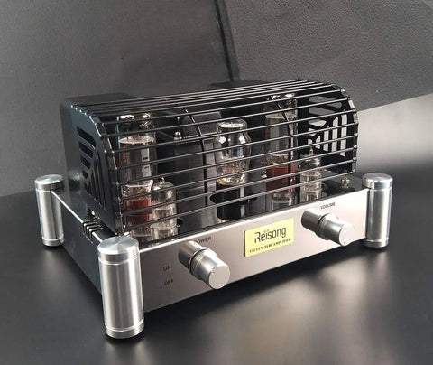 A12 EL34 12AX7 ECC83 Tube Amplifier for HiFi Stereo on black surface, showing vintage warmth and rich dynamics with tube cage.