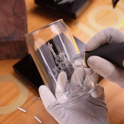 Engraving a glass with a Heavy Duty Handheld Engraver Pen With 24 Watt Motor And Dead Simple Speed Dial.