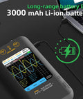 On-The-Go Handheld Oscilloscope With 3.98 Inch Touchscreen Dual Channel 50MHz Bandwidth And Signal Generator, charging near laptop