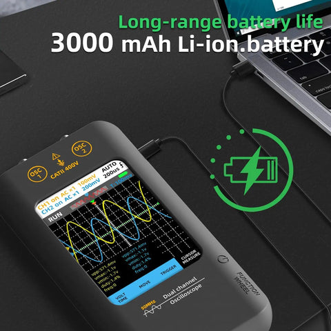 On-The-Go Handheld Oscilloscope With 3.98 Inch Touchscreen Dual Channel 50MHz Bandwidth And Signal Generator, charging near laptop