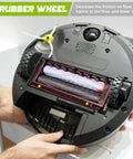 Pair Of Right And Left Drive Wheel Modules For Roomba Series Compatible With 500 600 700 800 900 And 880 860 960 980 Models Plug And Play Easy Install Replacement Upgrade For Consistent Traction And Smooth Cleaning Performance shown installed on a Roomba vacuum bottom view.