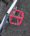 Wide Flat Platform Mountain Bike Pedals 9 By 16 Inch With Nylon Composite Bearings, Lightweight MTB Pedals, Red, Mounted on Bike