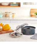 Dicing Accessory Kit For FP13 And SPF13 Food Processors With Dicing Blade, Grid, Cleaning Tool, Storage Case on kitchen counter.