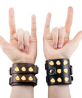 Hands displaying "rock on" gesture while wearing 60 Pairs Solid Brass Chicago Screws For Belts And Jeans Including Heavy Duty Hole Punch Kit For Leather Straps And Clothing Repair Built Like A Tank With Corrosion Resistant Gold Finish That Hits Different On Every Project.