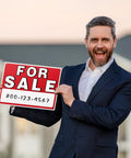 Man holding a For Sale sign outdoors, showcasing the Four Pack 14 By 10 For Sale Sign For Cars Double Sided Vehicle Signs With No Glue Residue On Windows Reusable Large Car For Sale Sign For Business Includes 20 Adhesive Pads And Easy Visibility.