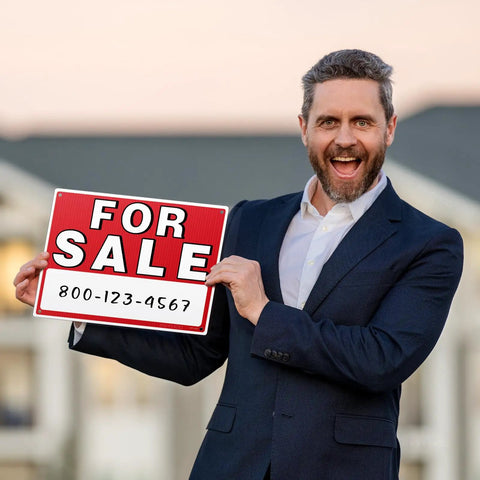 Man holding a For Sale sign outdoors, showcasing the Four Pack 14 By 10 For Sale Sign For Cars Double Sided Vehicle Signs With No Glue Residue On Windows Reusable Large Car For Sale Sign For Business Includes 20 Adhesive Pads And Easy Visibility.