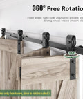 Close-up of 64-Inch Bi-Fold Sliding Barn Door Hardware Track Kit with side mounted black J shape rollers installed on wood doors.