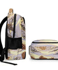 Side and top view of Winter Pine Landscape Backpack Unisex Daypack with large capacity, durable polyester fabric, and pine design.