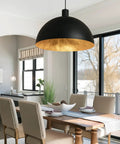 Black Dome Pendant Light With Dope Gold Leaf Interior, 20 Inch Industrial Chandelier installed over dining table