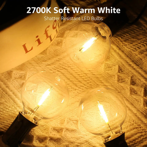 LED Outdoor String Lights For Patio 50ft With 26 Shatterproof G40 Globe Bulbs Waterproof Café Lights glowing on woven surface
