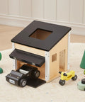 Wooden Dollhouse Garage Set With Workbench, Lawn Mower, Bicycle And Car For Kids on carpeted floor, showcasing realistic play accessories.