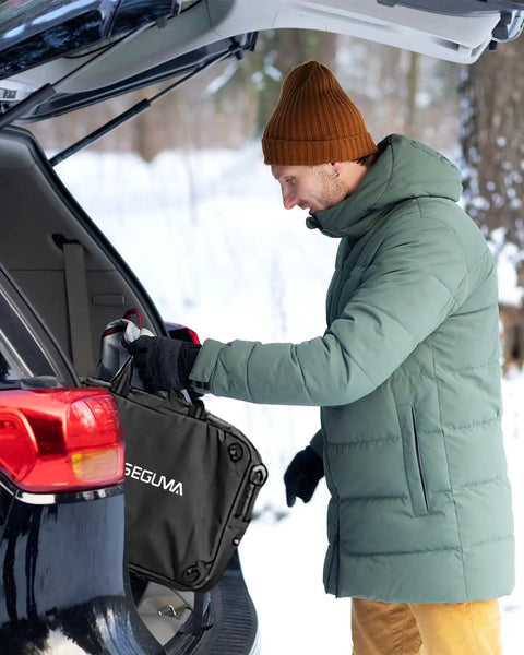 Legit Tesla Level One And Two Ev Charger Featuring Nacs Connector And ETL Certified in use, being stored in car trunk during winter.