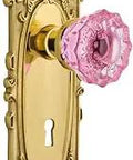 Old School Victorian Crystal Pink Glass Door Knob Set With Polished Brass Privacy Lock, featuring intricate brass plate design.