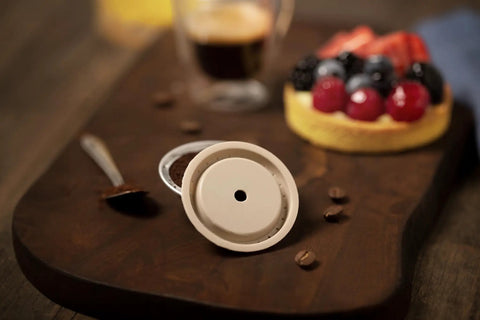 Reusable Silicone Capsule Cap For Nespresso Vertuo And VertuoLine Refills Made Easy Mess Free Compatible And Food Grade Italian Made Quality Pack Of 2 Caps Easy To Clean shown with dessert and coffee