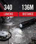 Dual Color LED Flashlight With White And Red Beams 315 Lumen Output Bullseye Spot Beam Optic on metal floor showing 340 lumens